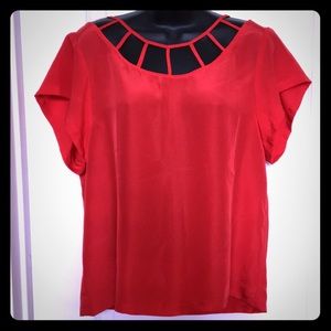 Stylish orangey red top